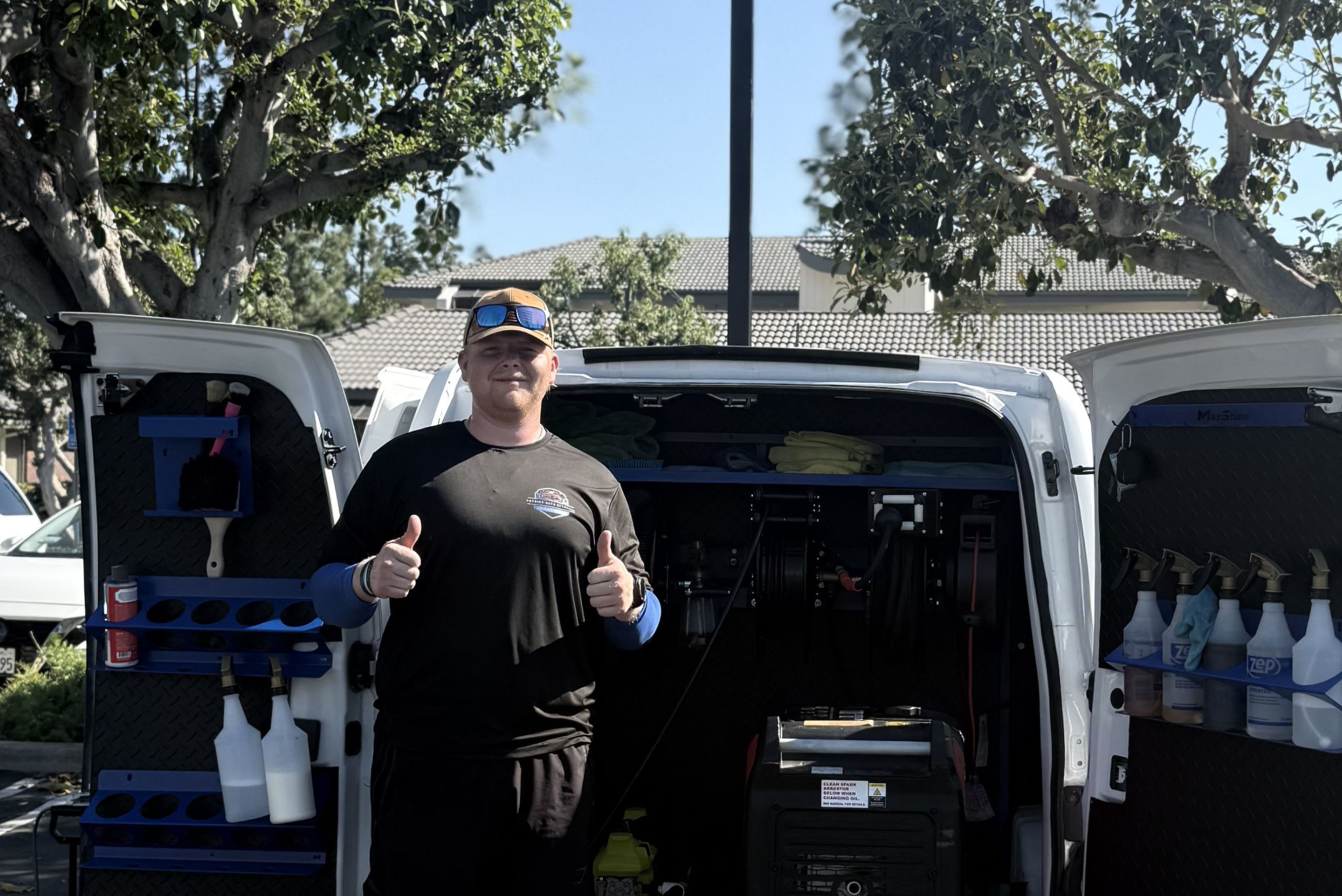 Patriot Auto Detailing owner in front of the work truck